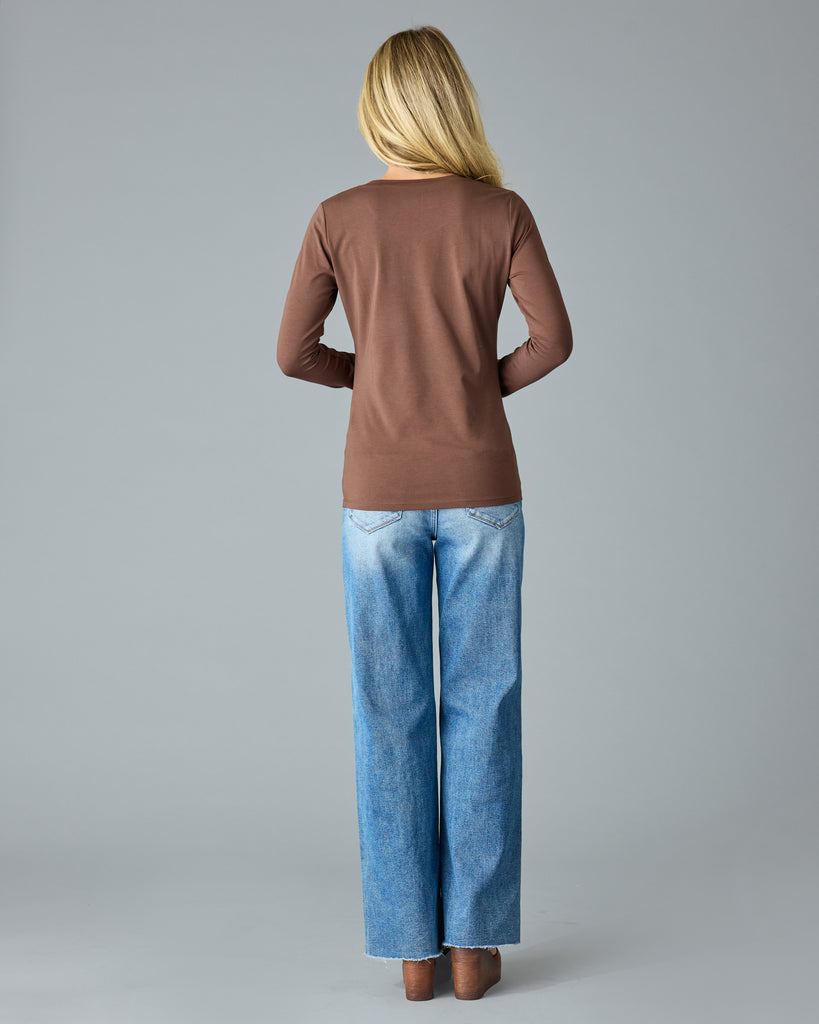 Woman in a brown, long sleeve basic t-shirt