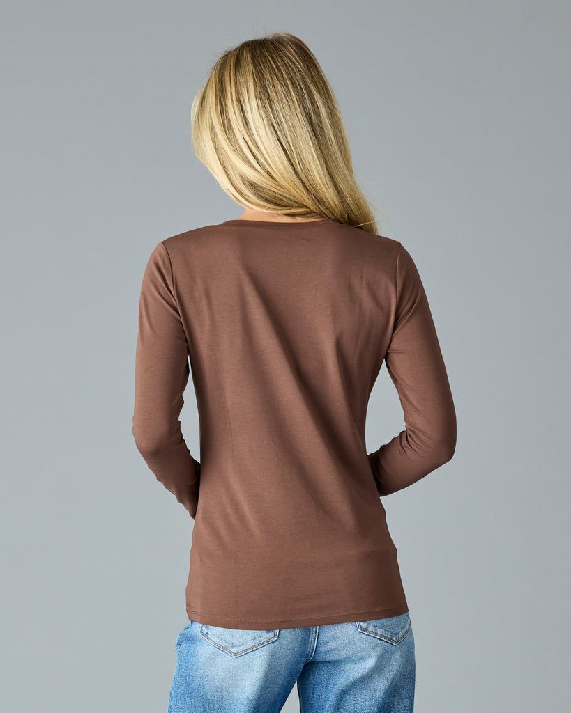 Woman in a brown, long sleeve basic t-shirt