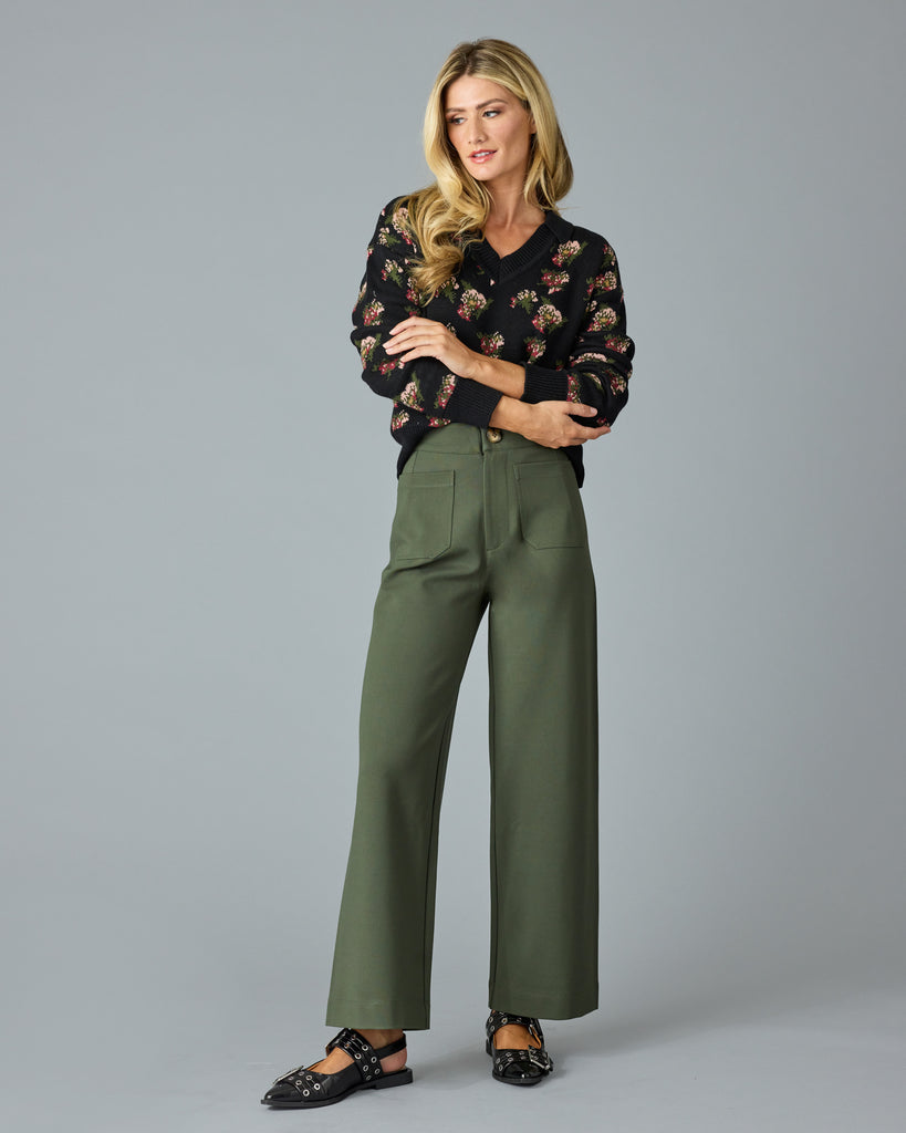 Woman in a pair of green, cropped trousers