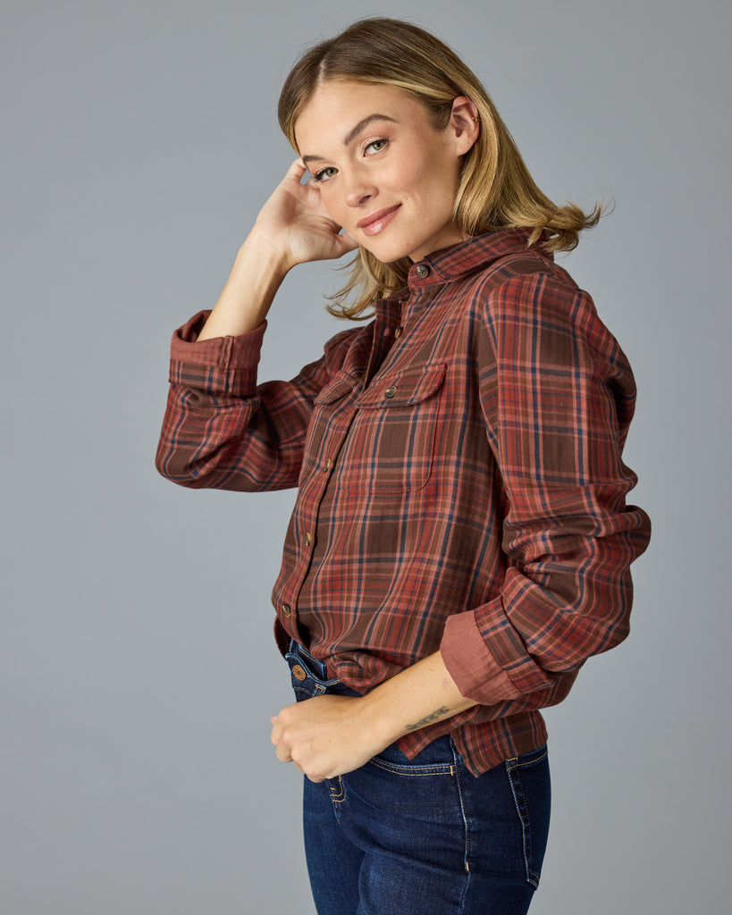 Woman in a red and brown plaid buttondown top