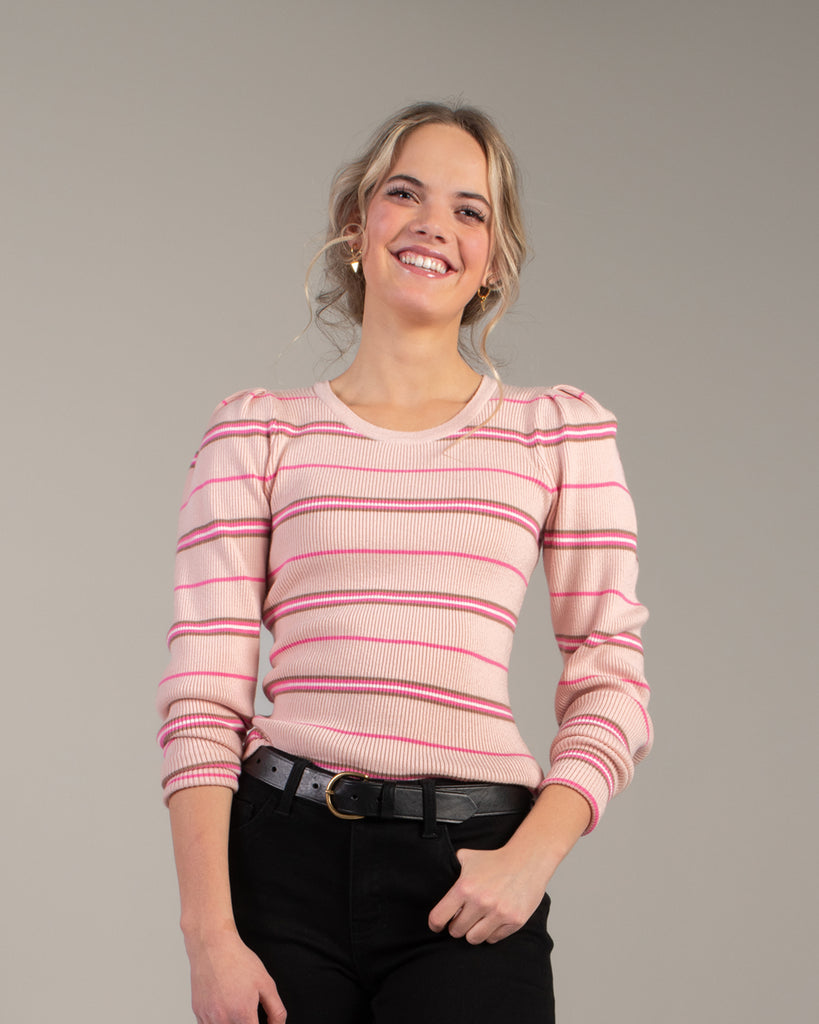 Woman in a pink striped long sleeve top