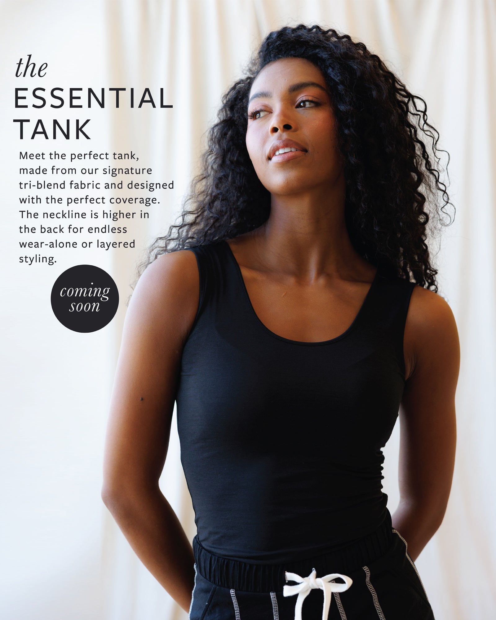Woman wearing a black tank top with promotional text about the 'Essential Tank' on a white background.