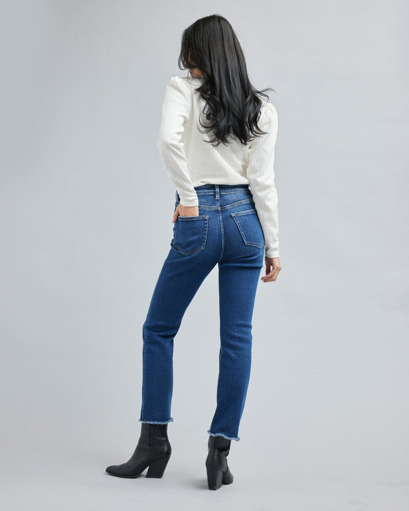 Woman in a blue washed denim pant