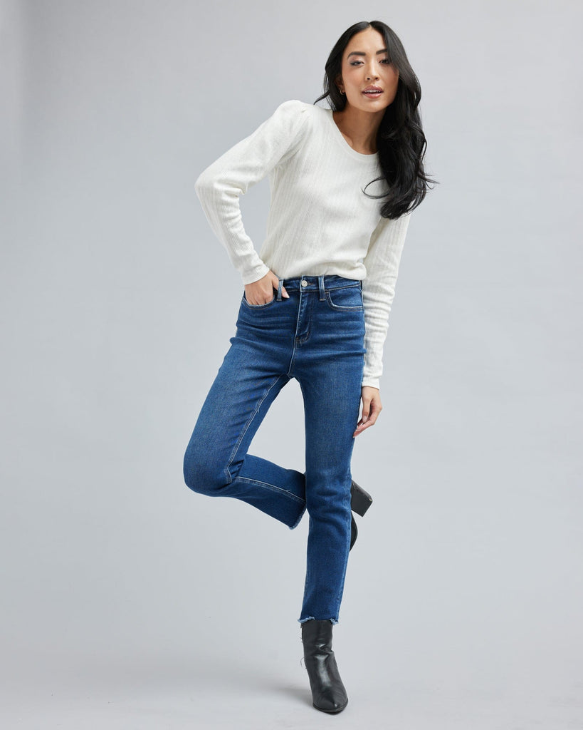 Woman in a blue washed denim pant