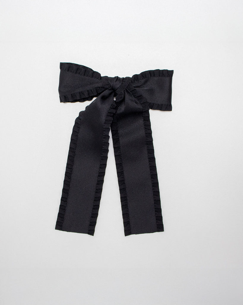 Black hair bow on a white background