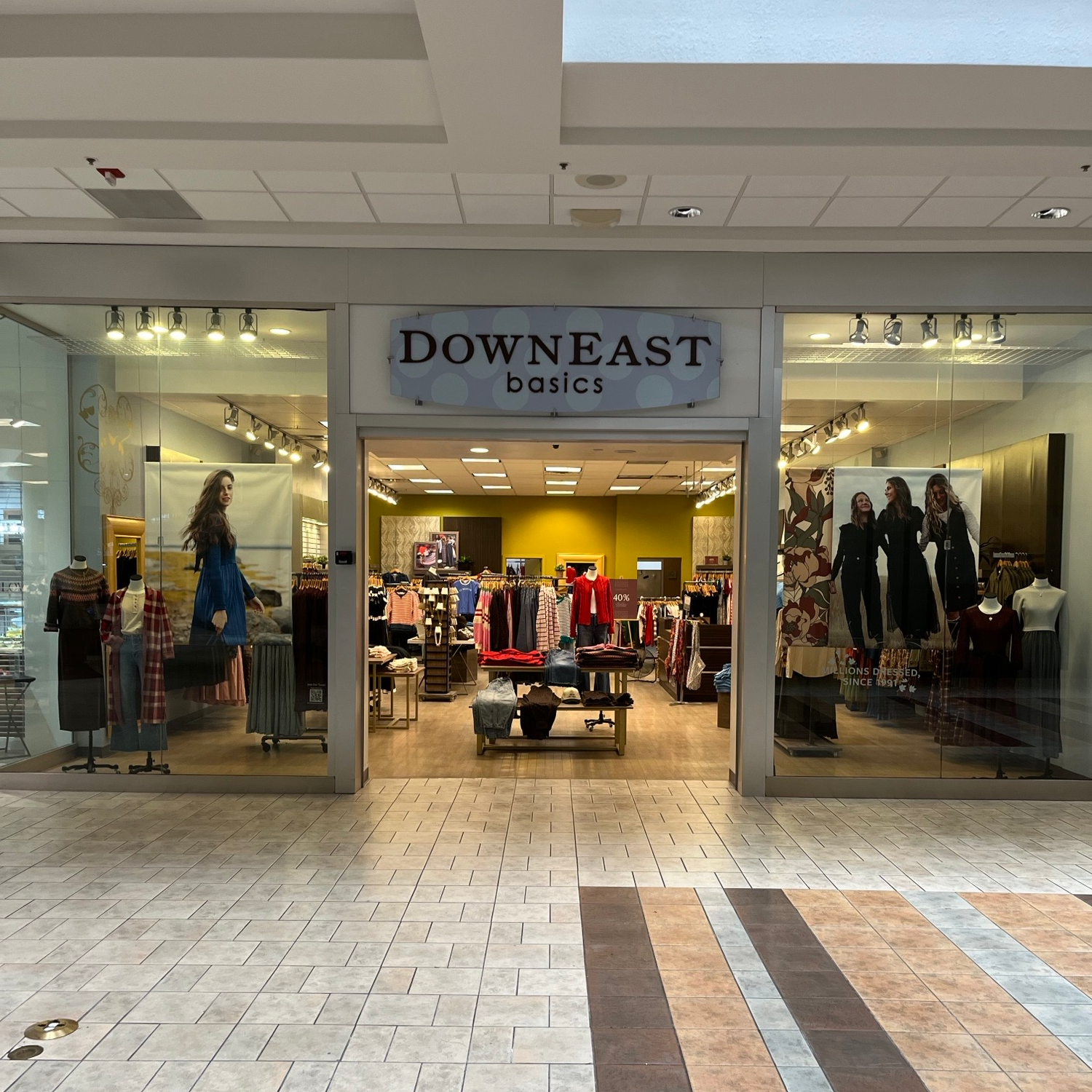 Storefront of Downeast Basics clothing store inside a mall