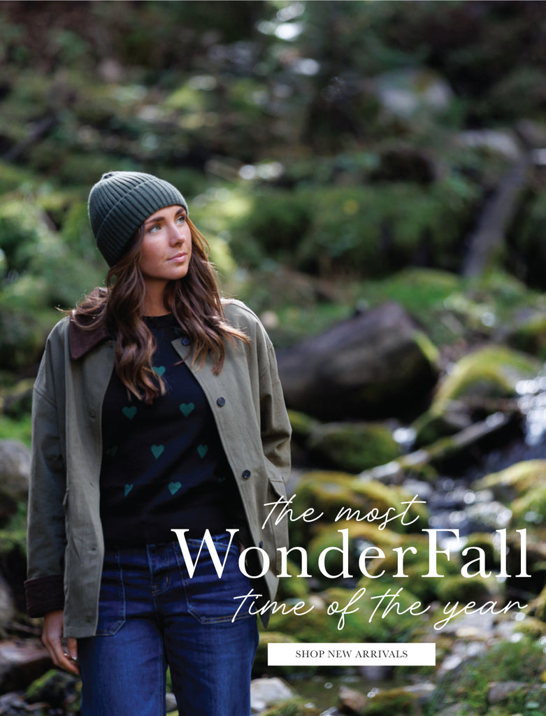 Woman in a forest setting with promotional text overlay says "The Most WonderFall Time of the Year" and has a button that says "Shop New Arrivals"