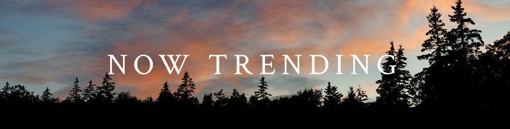 Scenic view with trees and a 'NOW TRENDING' text overlay