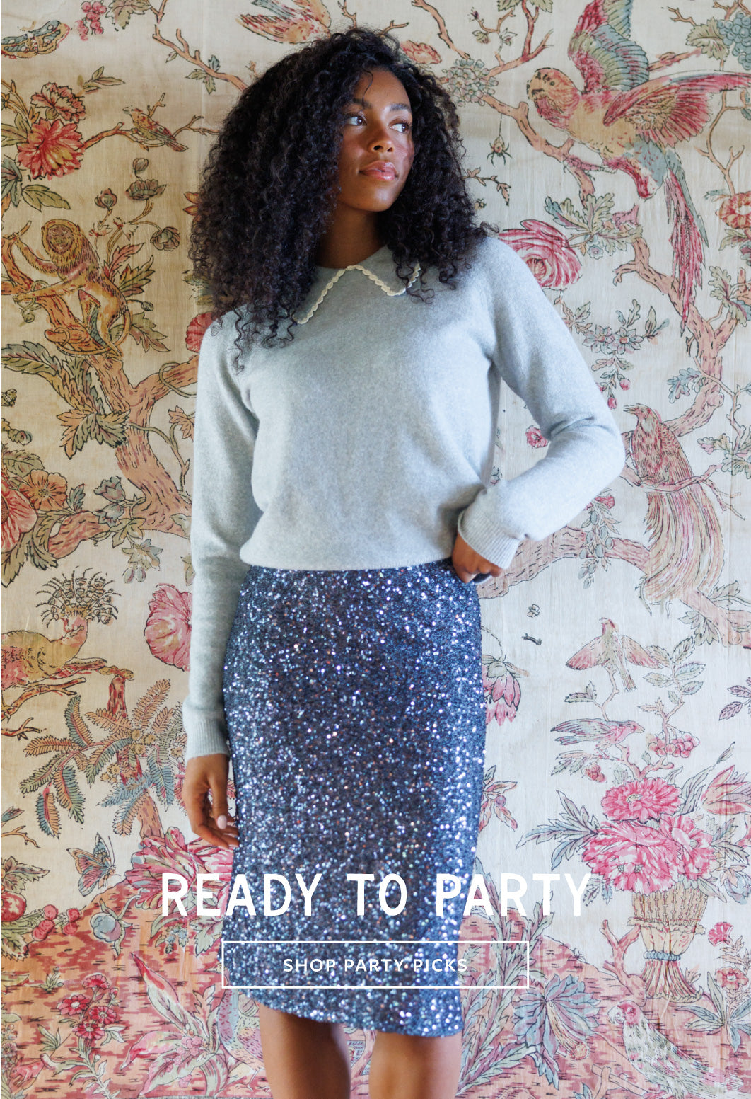 A woman stands against a vintage floral tapestry wearing a light gray knit sweater with a white collar and a blue sequined pencil skirt. White text overlay at the bottom reads 'READY TO PARTY' and 'SHOP.