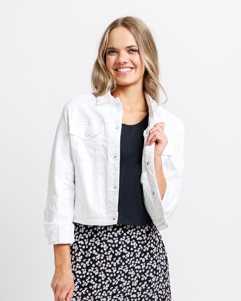 Model wearing a white denim long sleeve jacket.