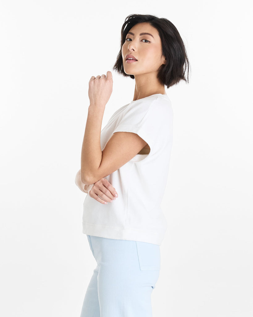 Woman in a white, short sleeve, basic tee