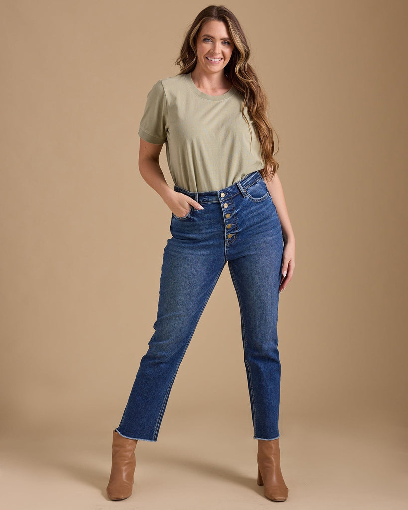 Woman in blue hi-rise straight jeans