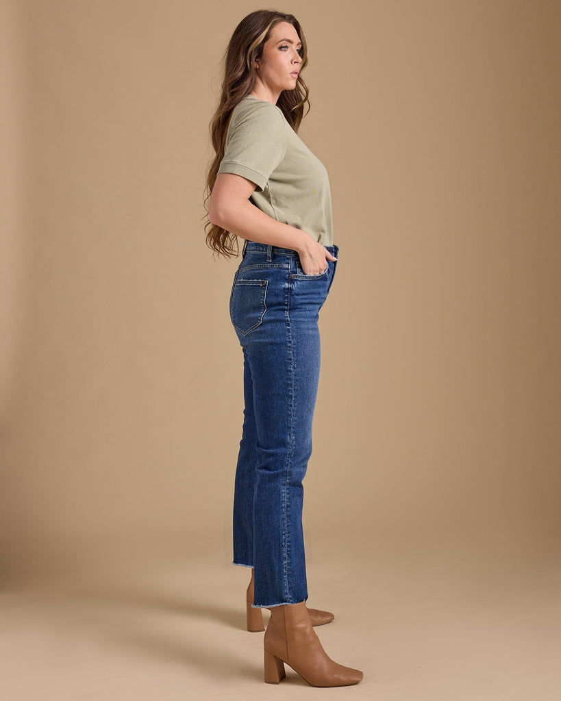 Woman in blue hi-rise straight jeans