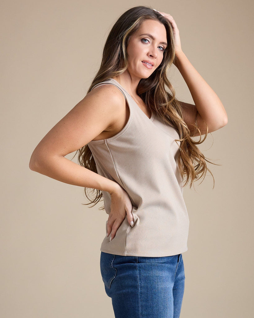 Woman in a tan sleeveless ribbed tank