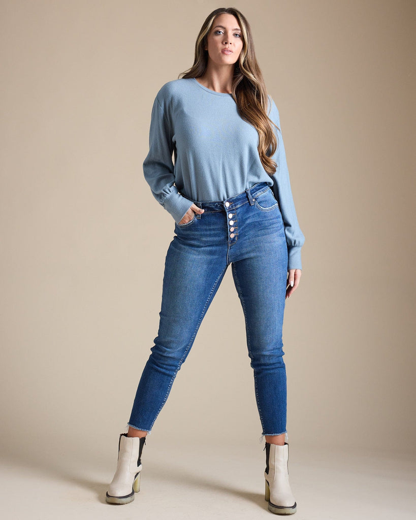 Woman in blue mid-rise skinny jeans