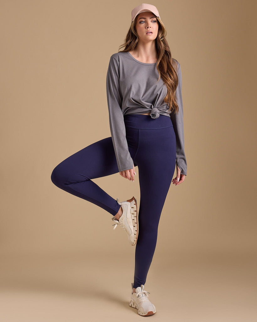 Woman in navy highwaisted leggings