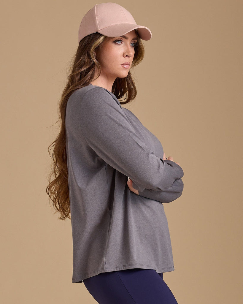 Woman in a grey long sleeve tshirt