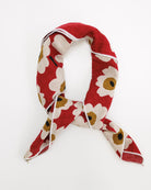 Red floral patterned scarf on a white background