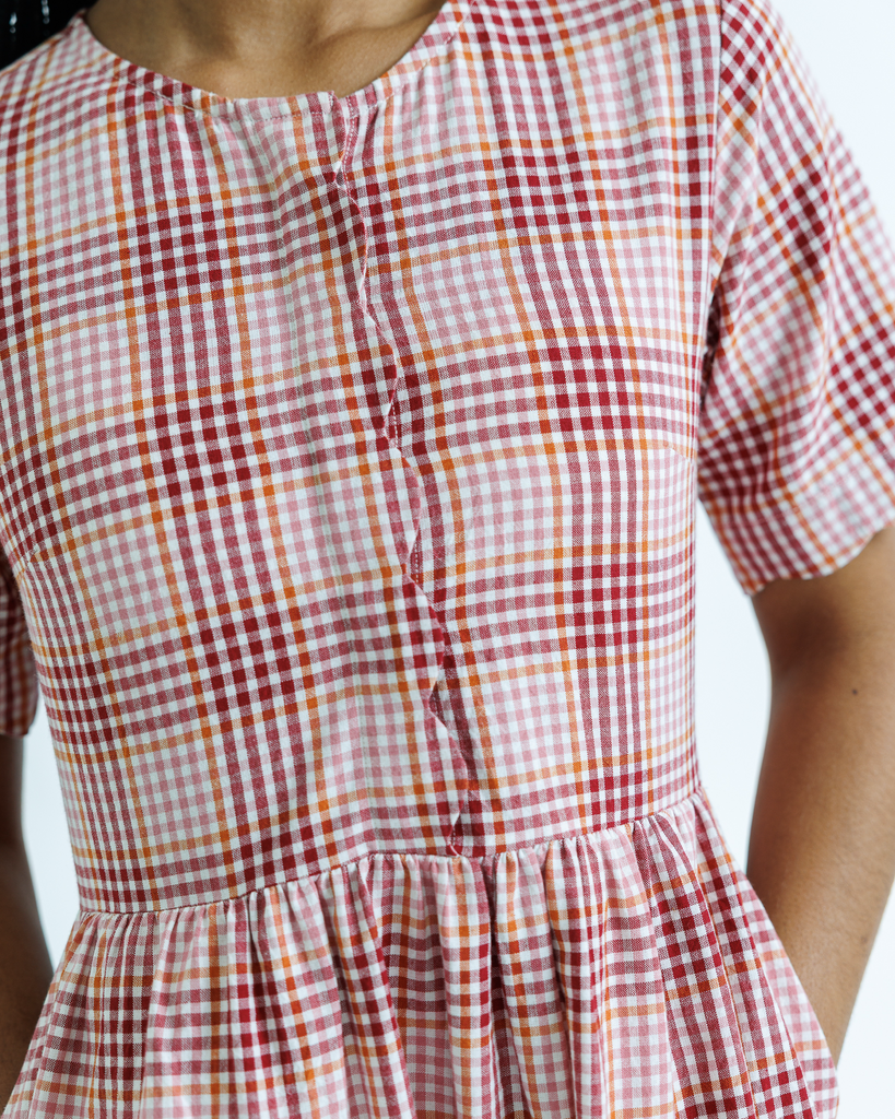 Pink and white plaid dress with a blurred background