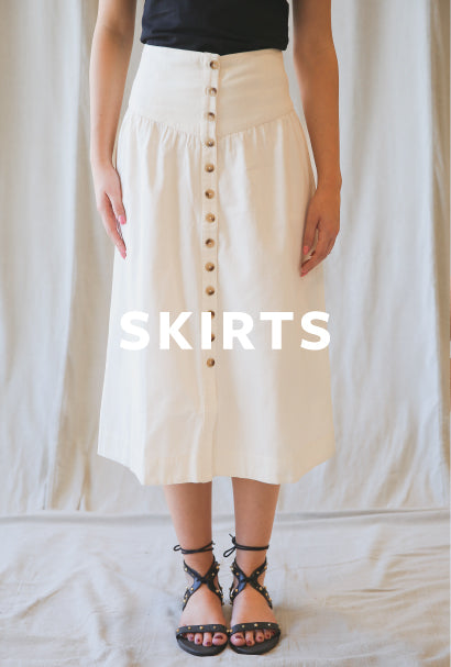 Image of person wearing a white midi skirt with SKIRTS text