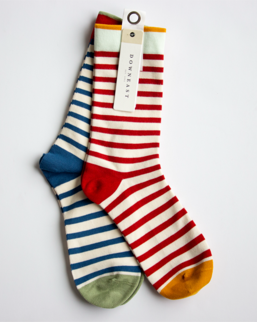 Two pairs of striped socks with a visible brand tag on a light gray background