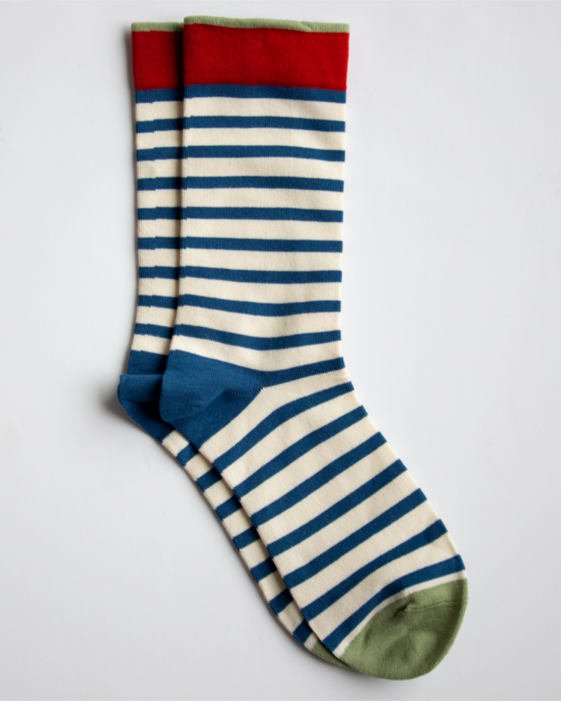Striped socks with red, blue, and green on a light gray background
