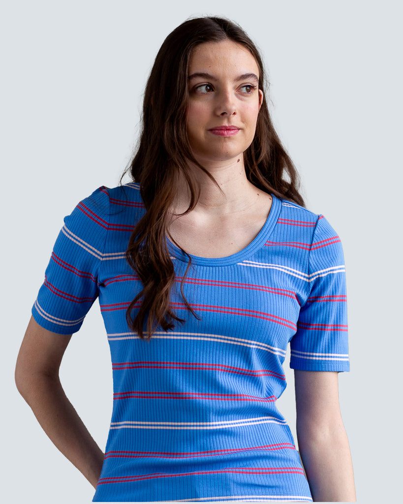 Model wearing a blue with white and red striped half sleeve scoop neck t-shirt