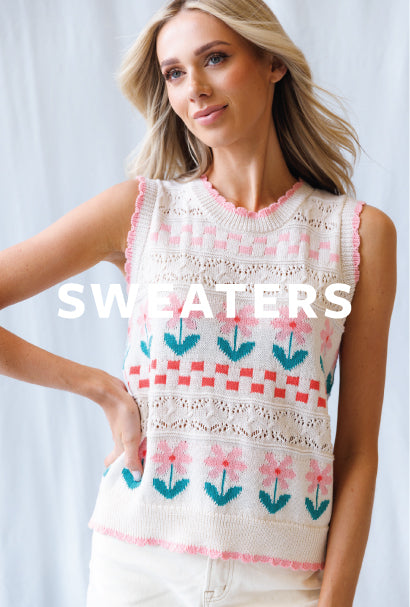 Image of woman wearing a floral print sleeveless sweater with SWEATERS text