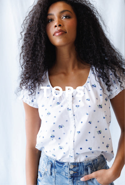 Image of woman wearing a white blouse with TOPS text